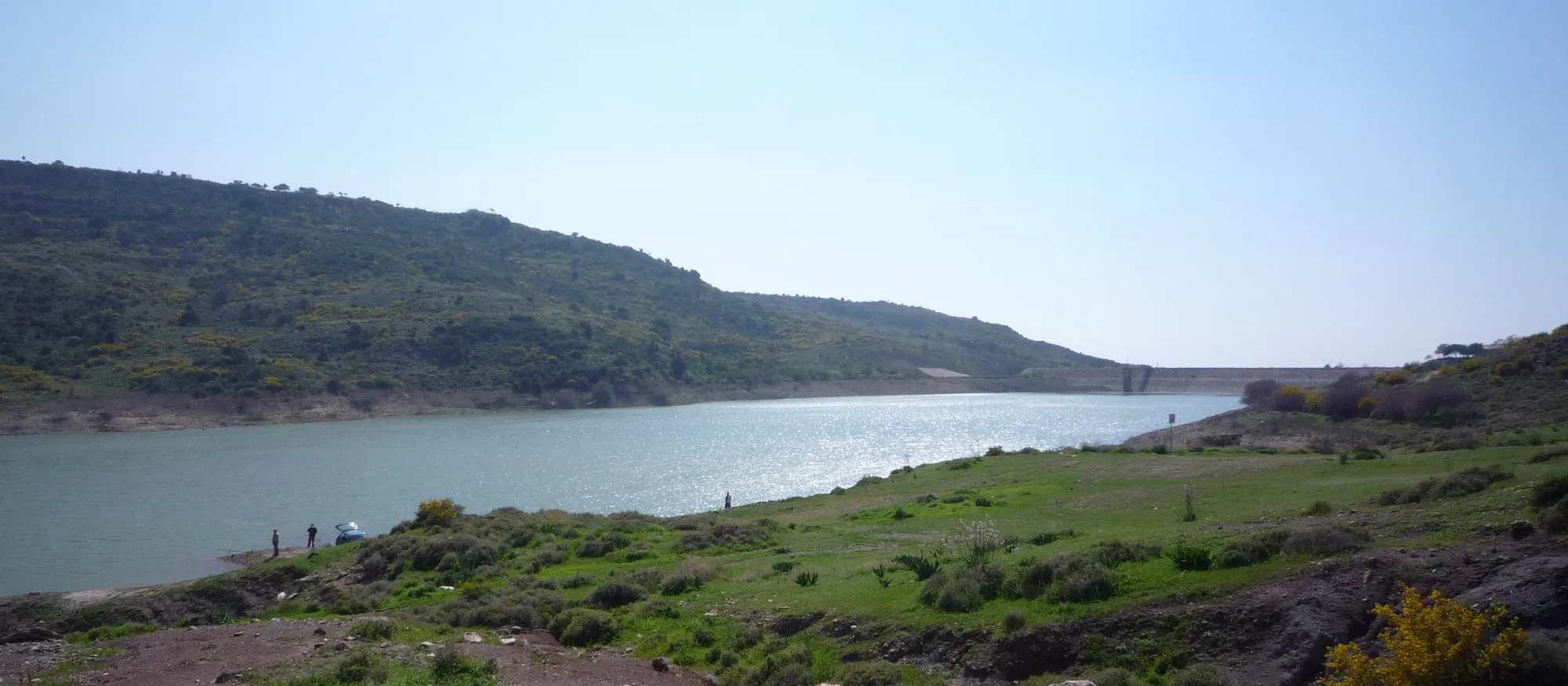 The Mavrokolympos reservoir among green hills in the Paphos countryside, on the same river that feeds the Adonis Baths waterfalls downstream