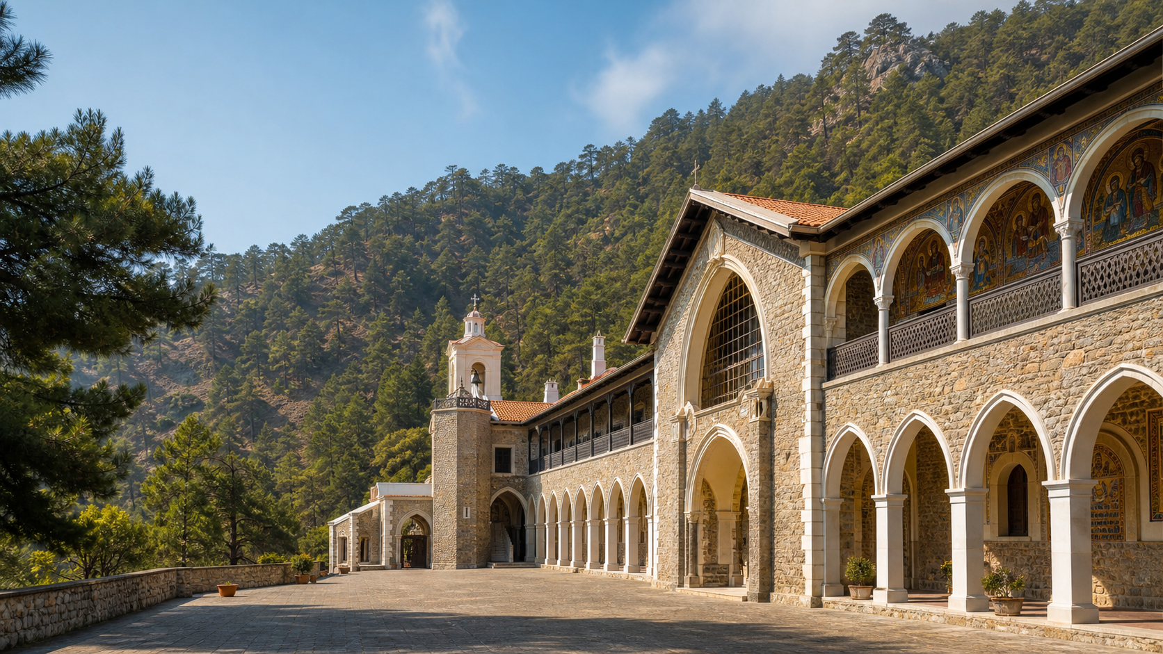 The stone arcades and painted exterior mosaics of Kykkos Monastery, set below pine-covered Troodos slopes
